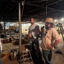 Crew members preparing a warehouse scene
